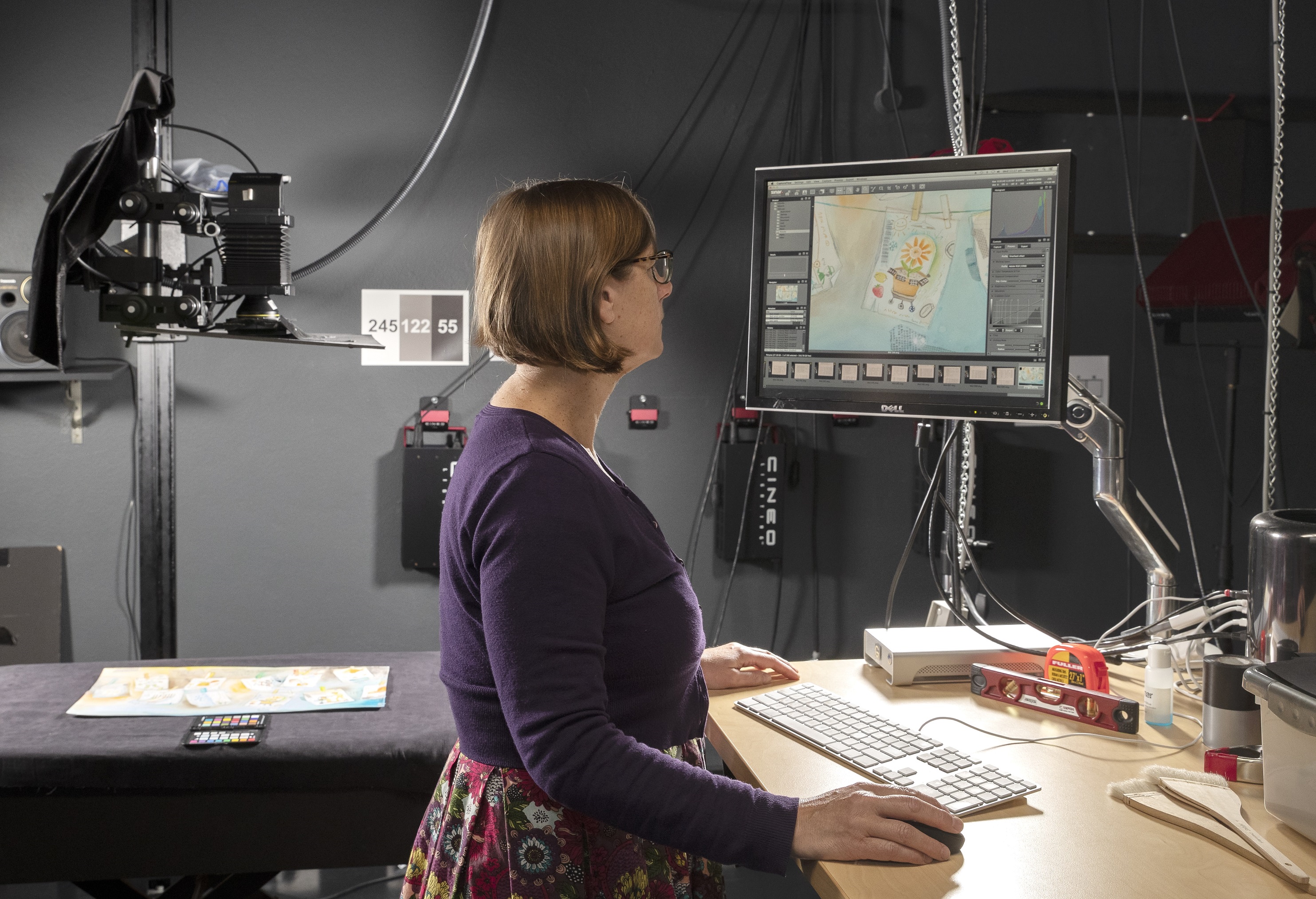 photo of a woman at work in a digitisation studio