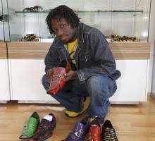 A shoe salesman visiting the African Business Centre with samples of his shoes, St Marys, New South Wales, 2010 [picture] / Louise Whelan 