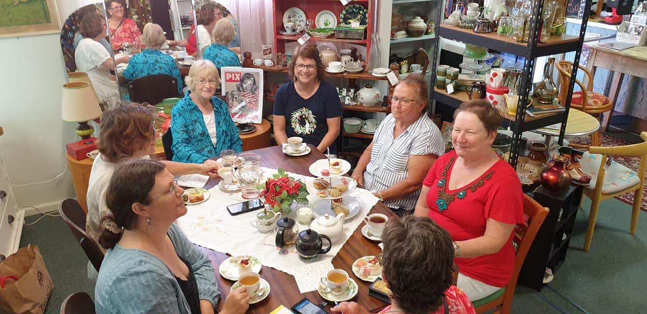 Women having tea together.