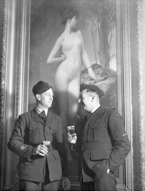 Two soliders drinking in front of Chloe painting