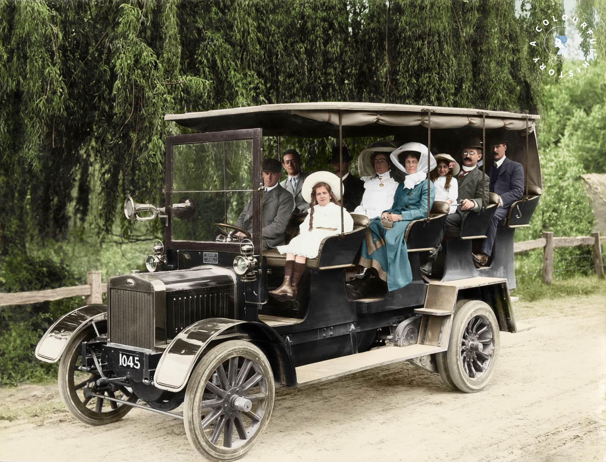 Group of people riding in a charabanc