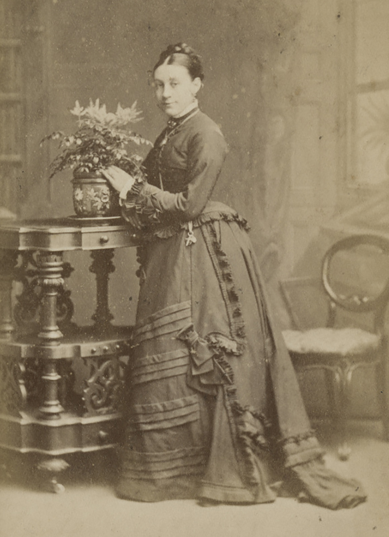 Women wearing a bustle dress