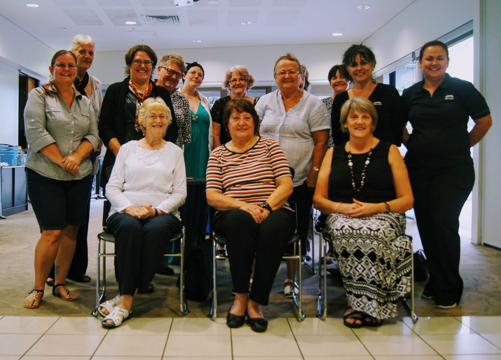 A group of women smile for the camera