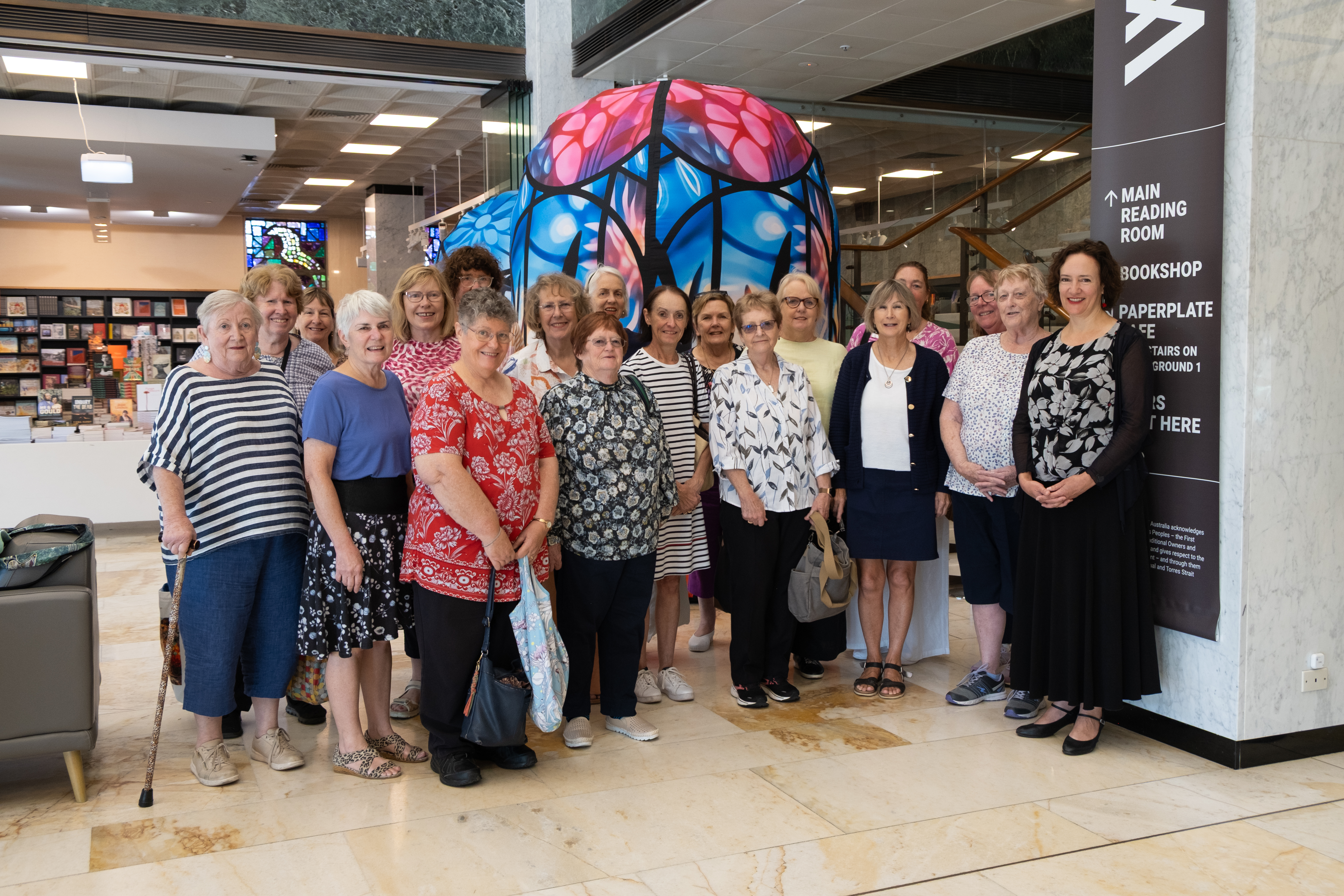 Group of women standing in the Library's foyer