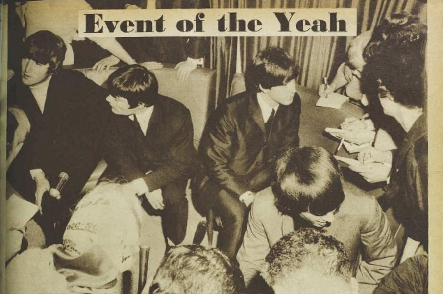 'Event of the yeah' newspaper article with an image of the Beatles sitting together talking to the press. 