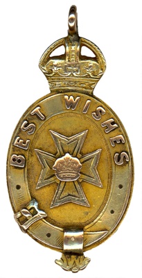 A gold medallion with the words 'best wishes' on it.