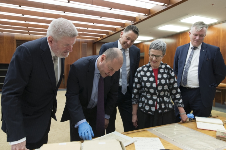 Treasurer Josh Frydenburg looking at Monash collection material