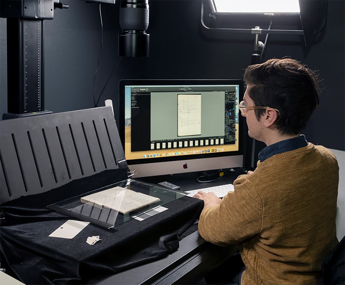 library staff using book scanner