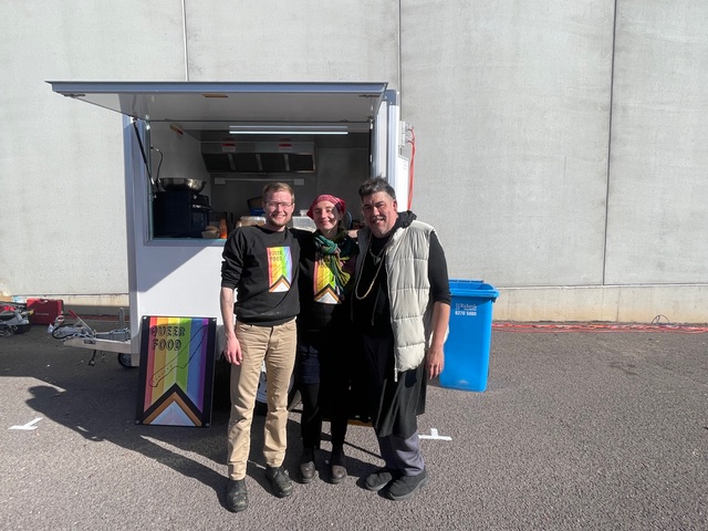 Andy de Groot and other members of the Queer Food team standing in front of the food truck