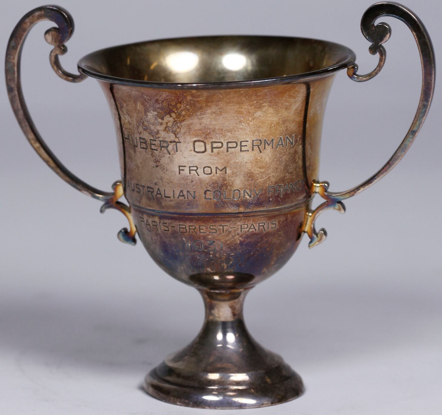 Paris-Brest-Paris Race cup trophy with Hubert Opperman engraved on the front.