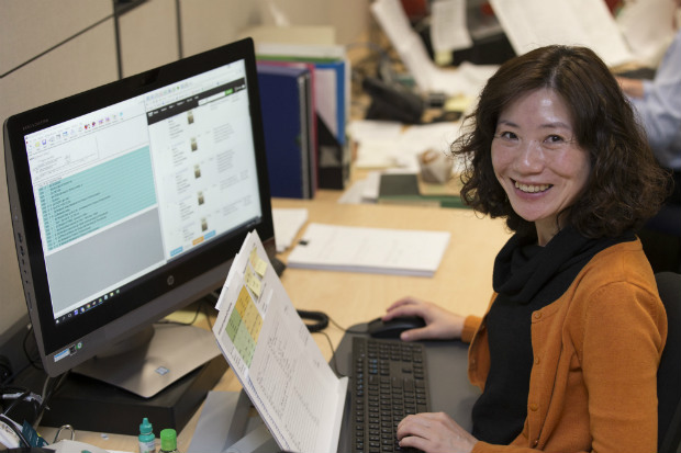 photo of a woman using cataloguing tools