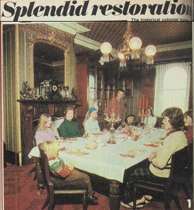 Article on the renovation of the Monte Cristo Homestead. There is a photograph of a family sitting around a large dining table.