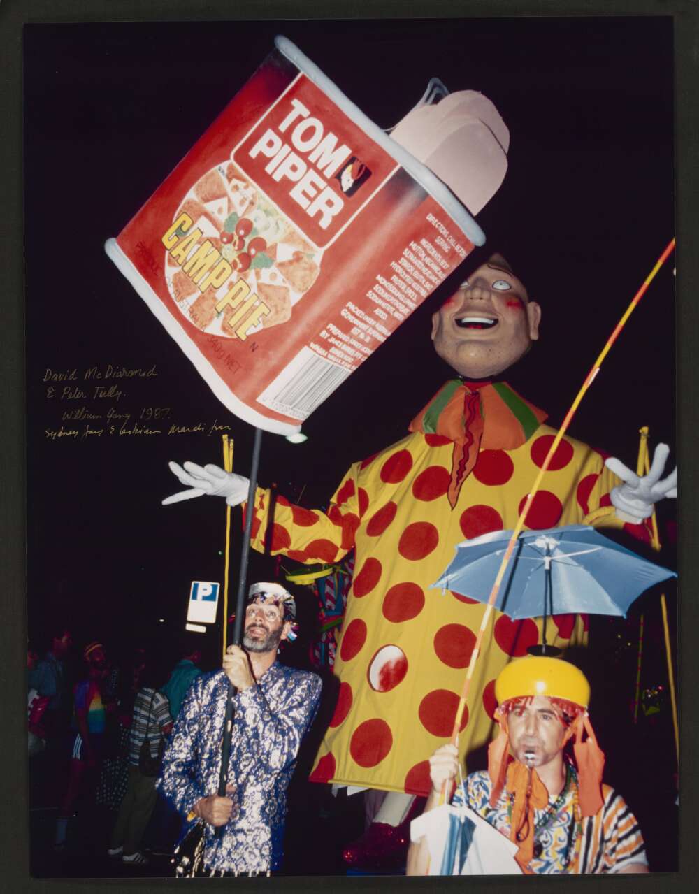 David McDiarmid and Peter Tully at the Sydney Gay & Lesbian Mardi Gras. They are appearing with a large novelty can of camp pie.