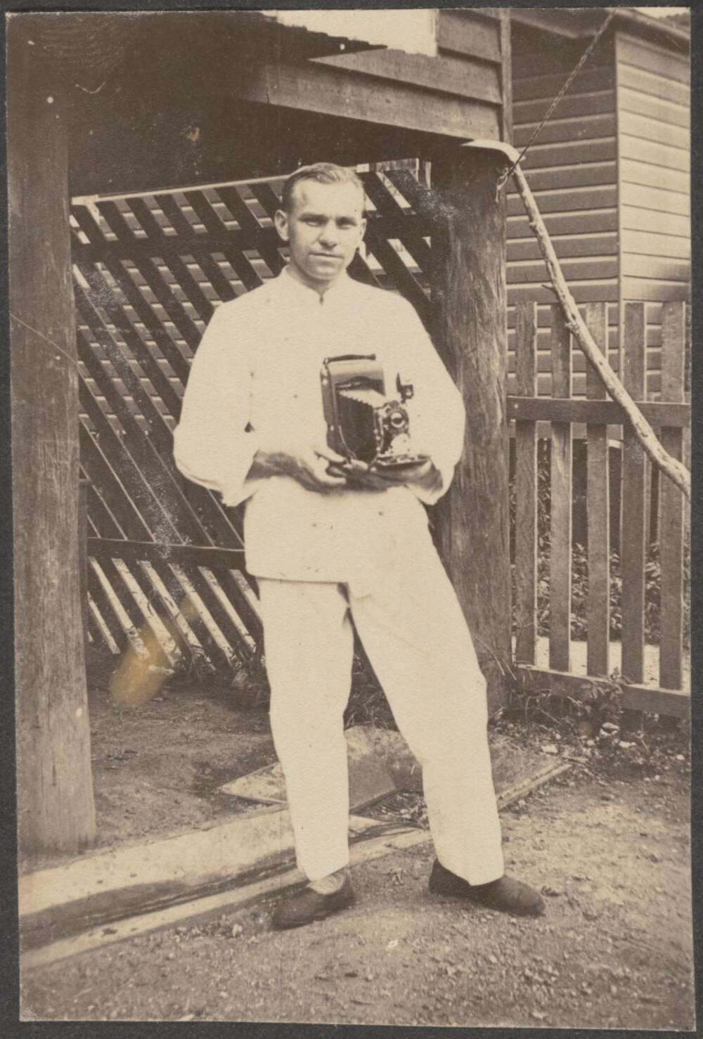 Carl Schiesser holding his camera