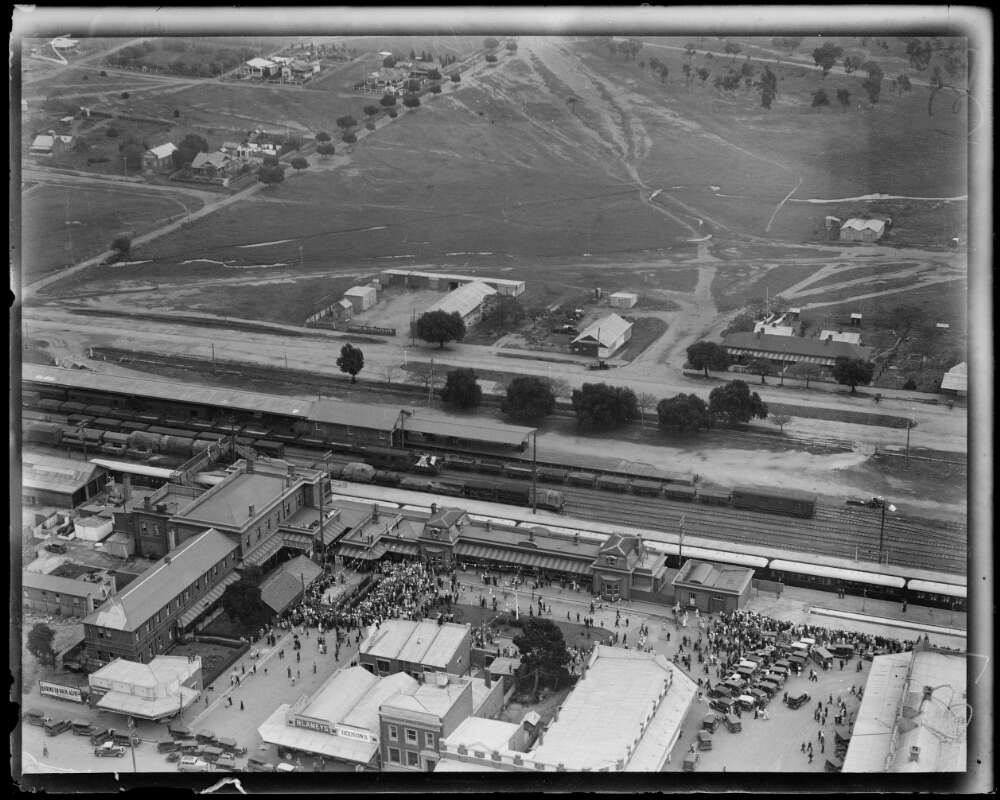 Aerial view of Junee including buildings, houses and farmland.