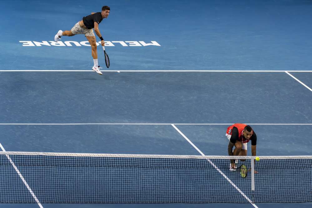 Nick Kyrgios and Thanasi Kokkinakis in action playing tennis doubles