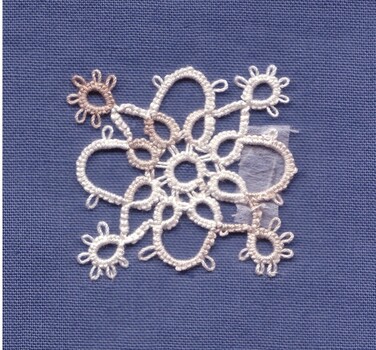 A lace design on a blue background.