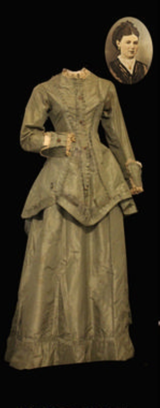 A sepia image of a wedding dress with a headshot of a woman in the top right corner.
