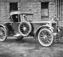 A vintage two-seater car. 