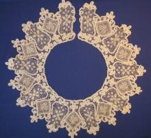 A white lace design on a blue background. 