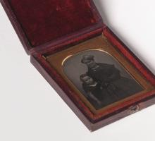 Daguerreotype portrait of a women and little boy in a wooden case