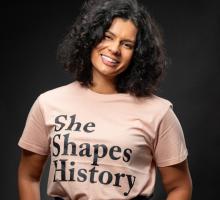 Portrait of Sita Sargeant wearing She Shapes History t-shirt